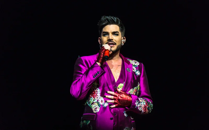 Adam Lambert Reflects on Touring with Queen and Its Impact on His Career and Finances